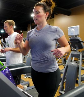 A couple prepares for the upcoming hunting seasons at Denver Gym and Fitness. Photo by Jerry Neal/CPW