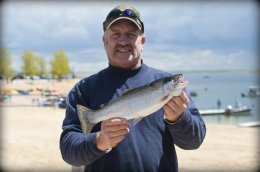 Man holding a trout Fisherman with trout