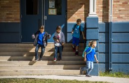 photo - Students run out of Helen Hunt Elementary School after the bell rings on Friday, October 9, 2015. Helen Hunt Elementary School faces potential closure and relocation to Adams Elementary School, which was closed in 2009 instead of Helen Hunt Elementary. Photo by Stacie Scott, The Gazette